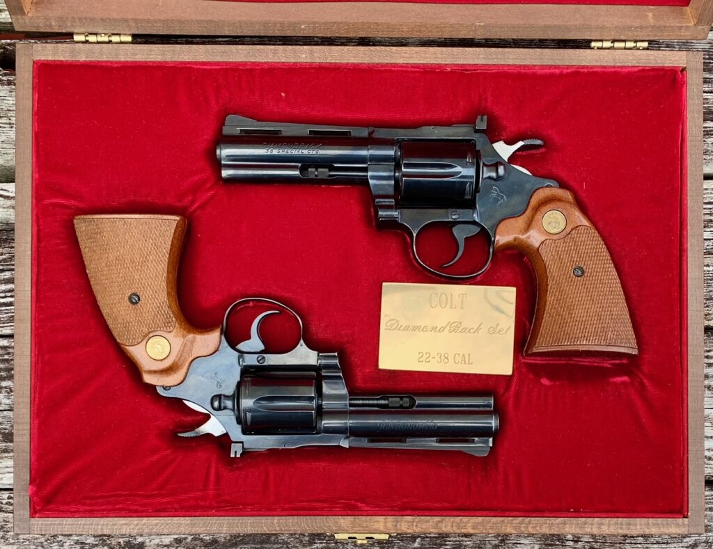 Colt Diamondback Cased Pair 22LR & 38 SPL 4″ Blue Walnut Two-Guns (Used) – D26020